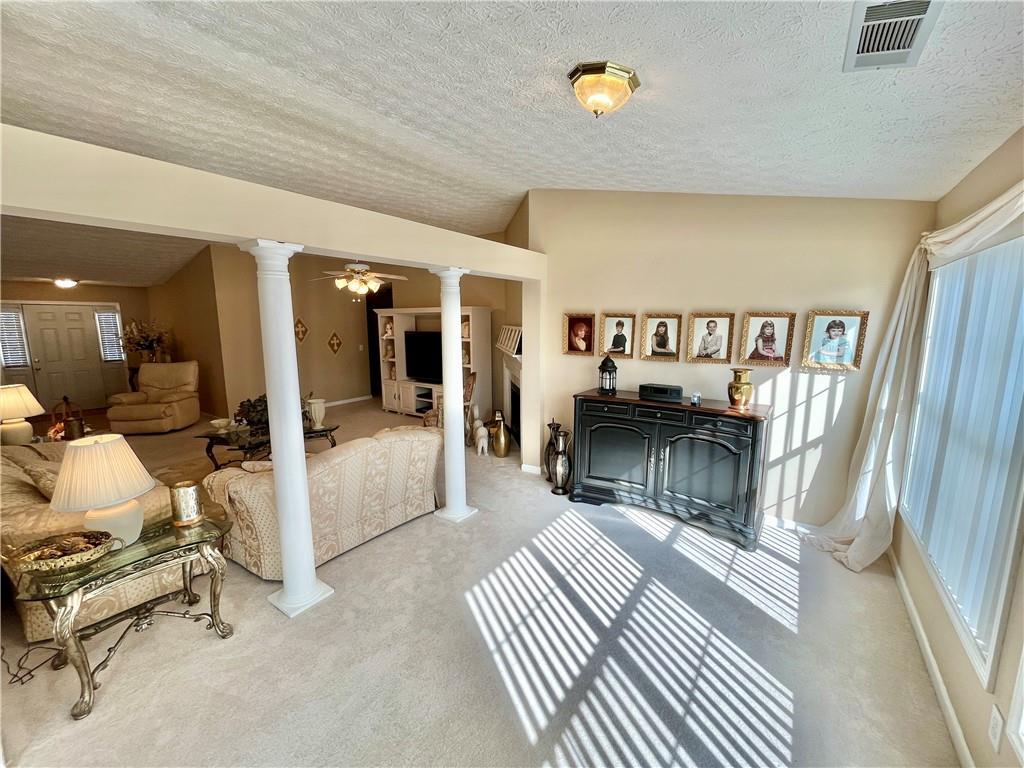 19 Meadow Crest Court Powder Springs, GA 30127 - Photo 5 of 26 a bedroom with furniture and a large window
