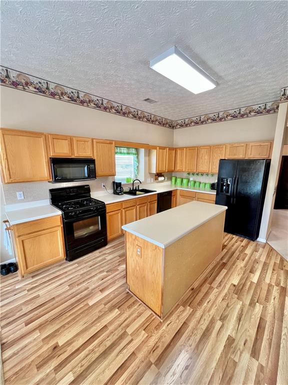 19 Meadow Crest Court Powder Springs, GA 30127 - Photo 7 of 26 a large white kitchen with a stove a sink and a microwave