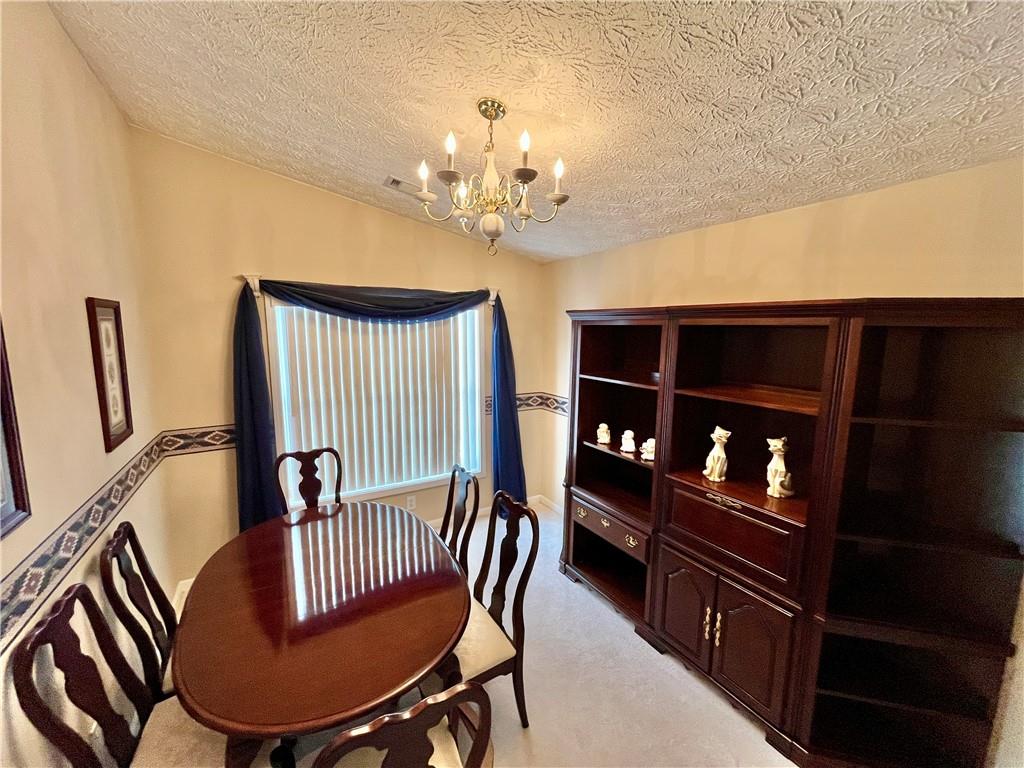 19 Meadow Crest Court Powder Springs, GA 30127 - Photo 9 of 26 a view of a dining room with furniture