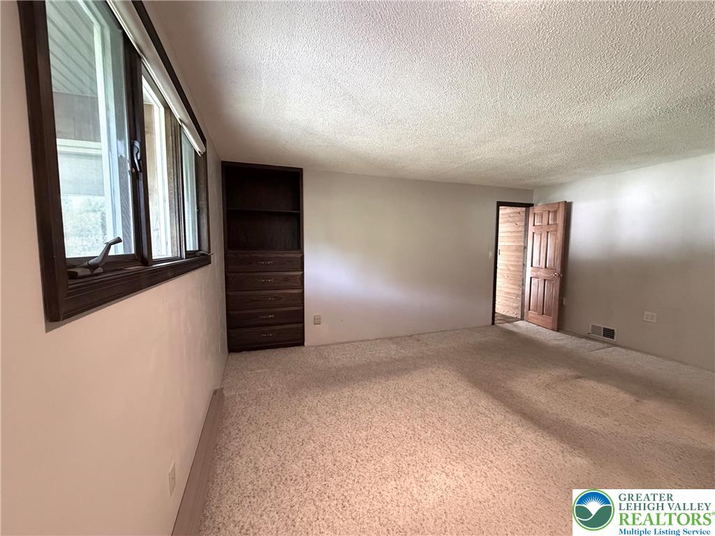 2741 Limestone Street Coplay, PA 18037 - Photo 24 of 35 Well-lit room with ample natural light and built-in shelving provides functional living.