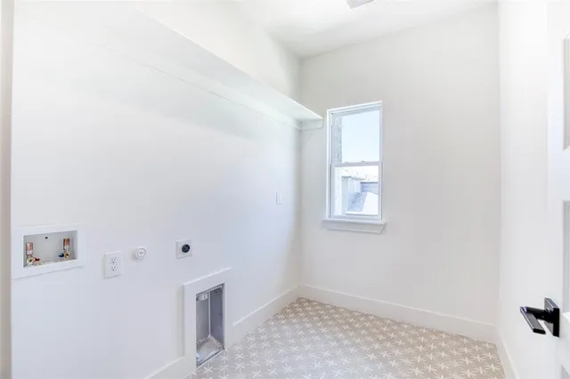 a view of a workspace with furniture and a rug