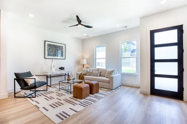 a living room with furniture rug and window