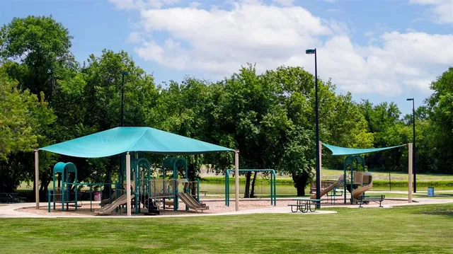 a view of a swimming pool with a yard