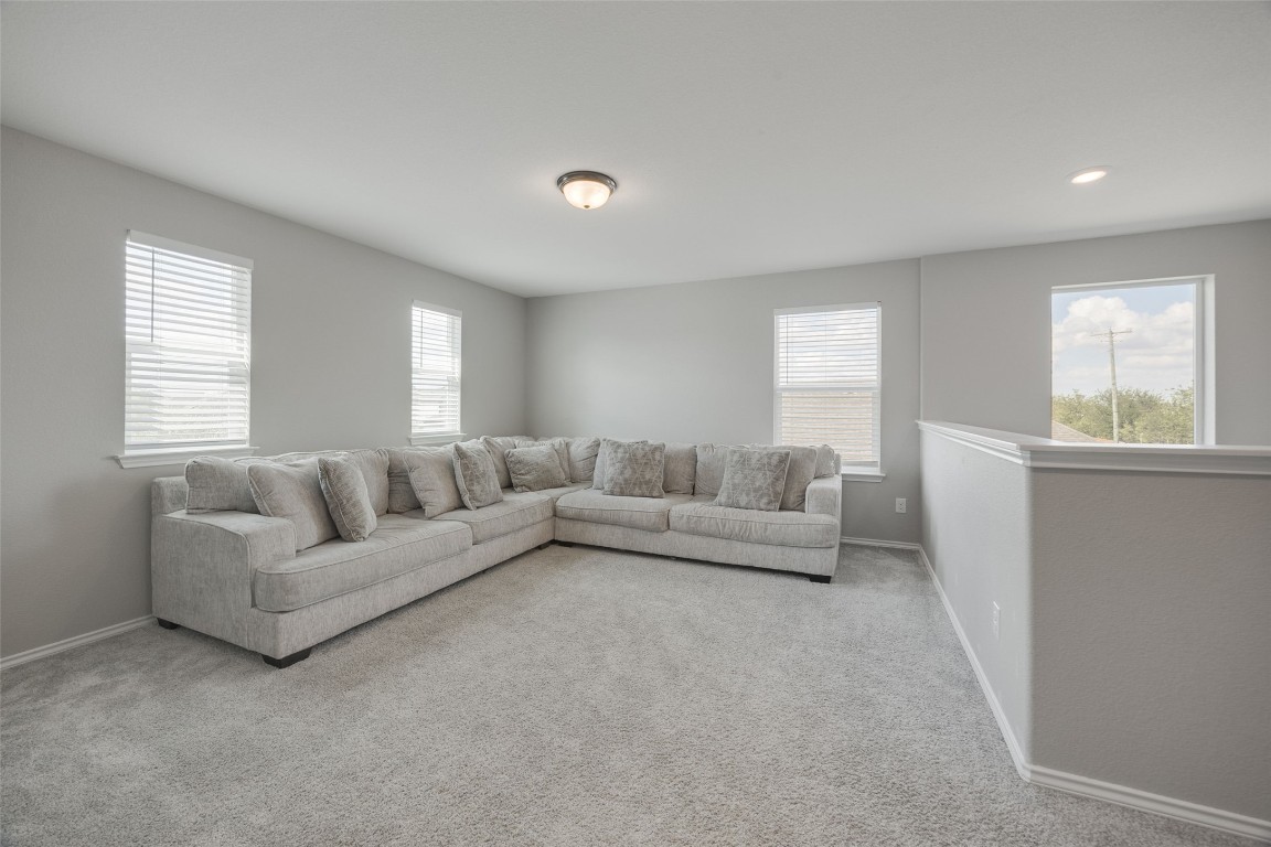214 Saranac Drive Elgin, TX 78621 - Photo 21 of 37 a living room with furniture and a large window