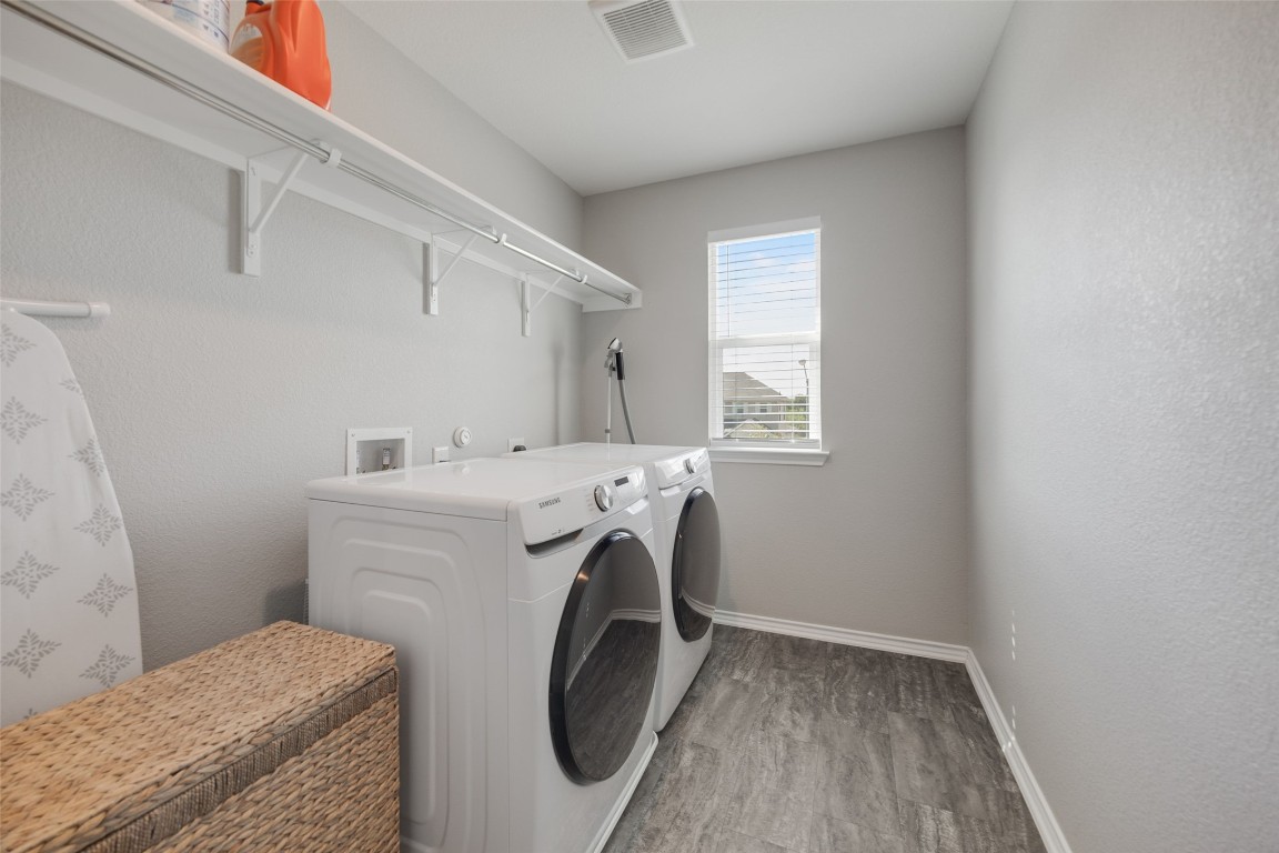 214 Saranac Drive Elgin, TX 78621 - Photo 29 of 37 a utility room with dryer and washer