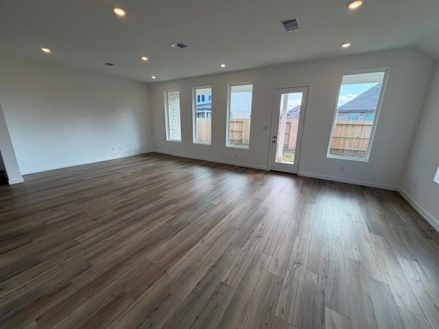 5518 Red Snapper Drive Baytown, TX 77521 - Photo 4 of 11 a view of an empty room with wooden floor and window