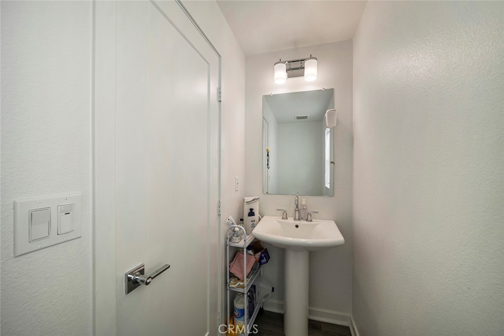 229 Scratch Road Covina, CA 91722 - Photo 16 of 29 a bathroom with a sink and a mirror