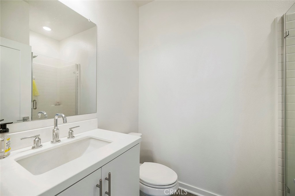 229 Scratch Road Covina, CA 91722 - Photo 7 of 29 a bathroom with a sink a toilet and mirror