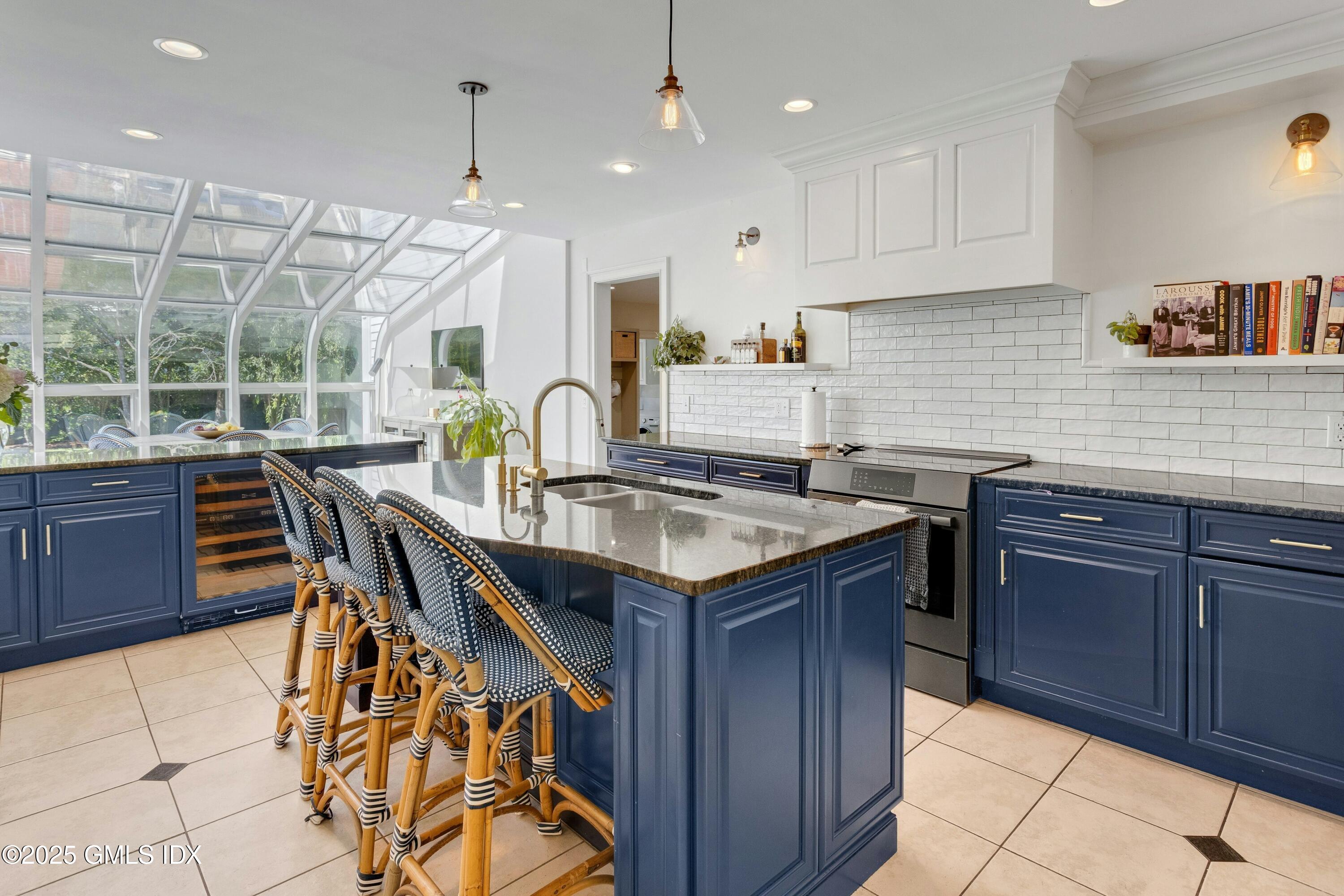 40 Willowmere Circle Riverside, CT 06878 - Photo 13 of 34 a kitchen with granite countertop a sink and cabinets