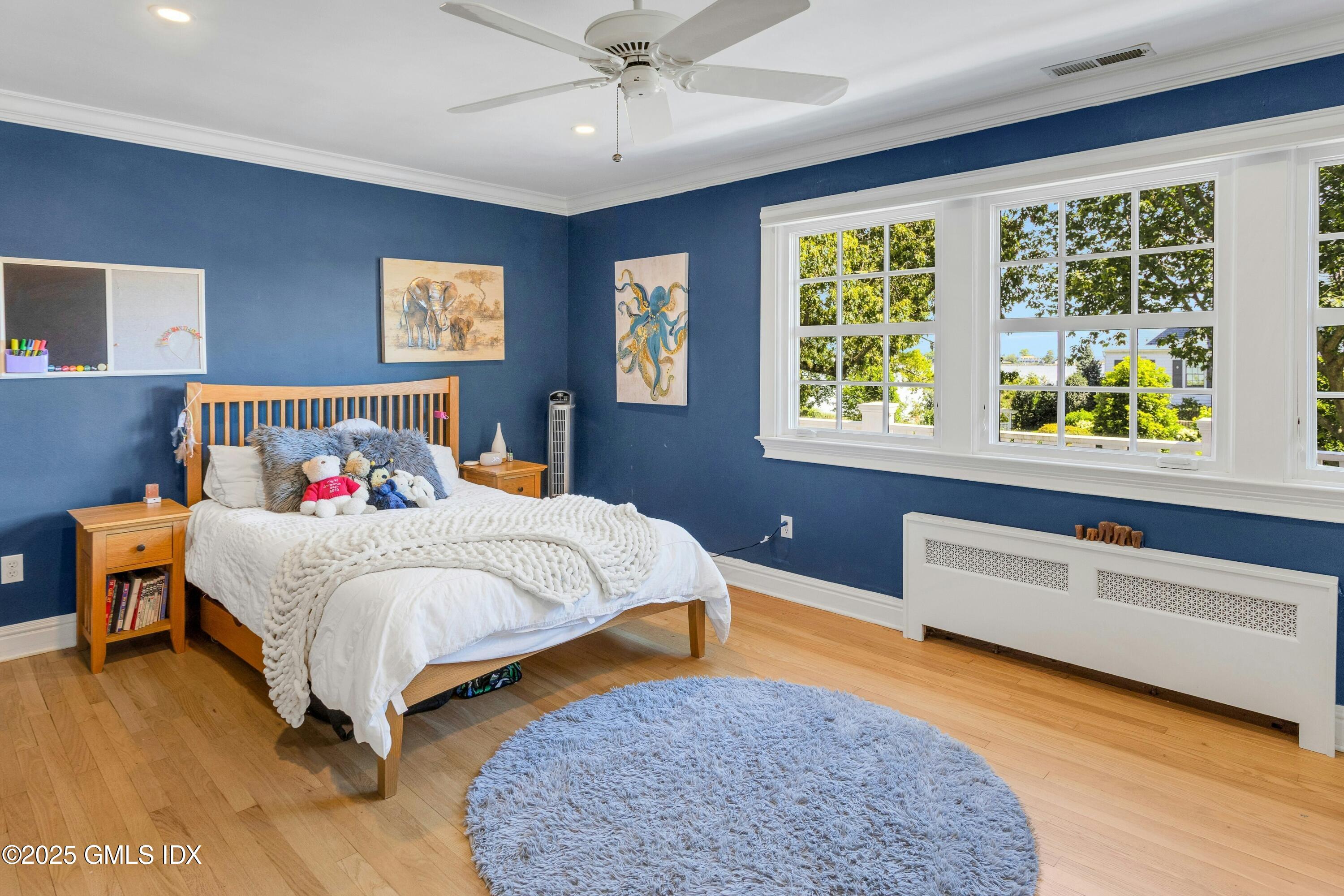 40 Willowmere Circle Riverside, CT 06878 - Photo 22 of 34 a bedroom with a bed and a dresser next to a window