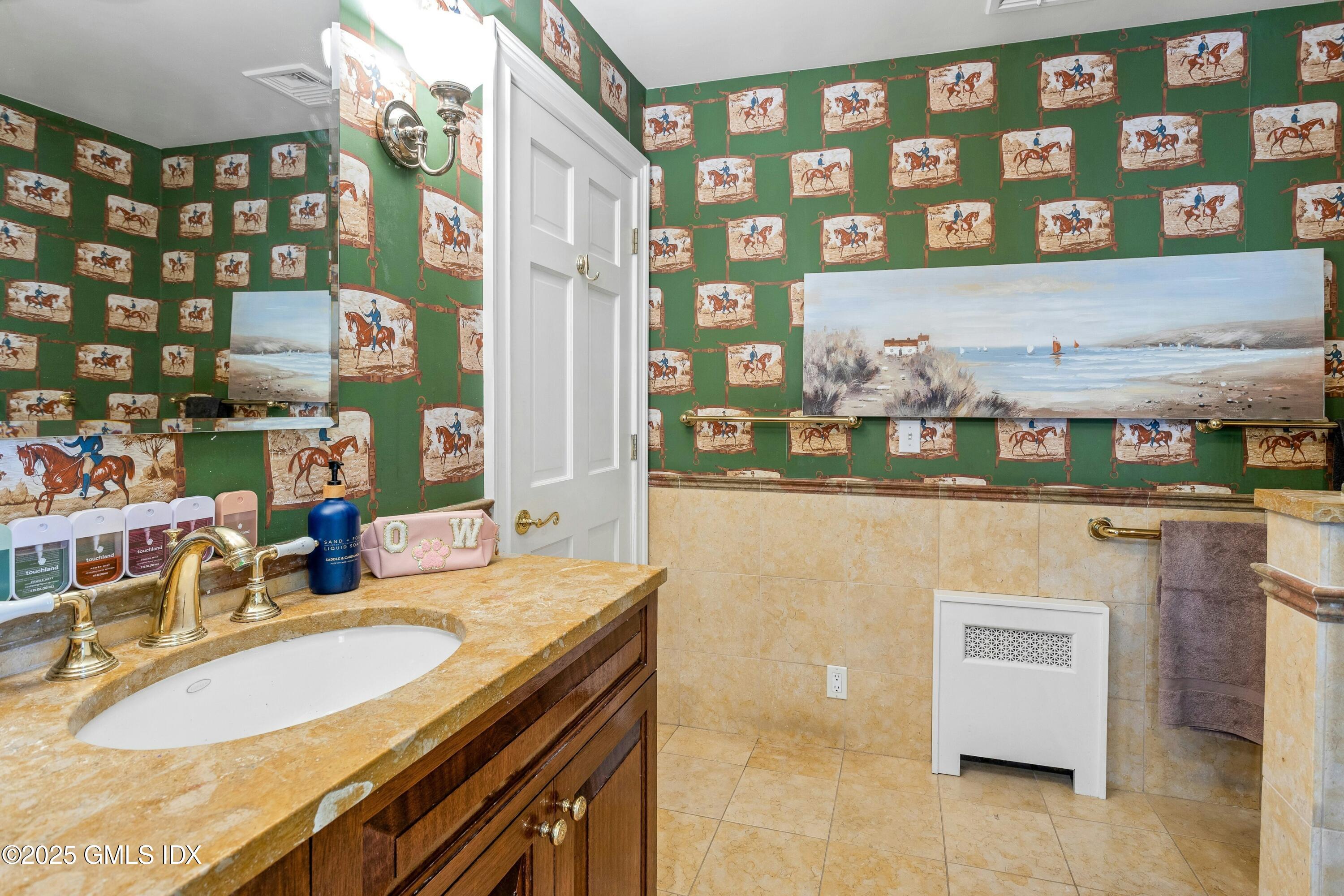 40 Willowmere Circle Riverside, CT 06878 - Photo 25 of 34 a bathroom with a sink and a mirror