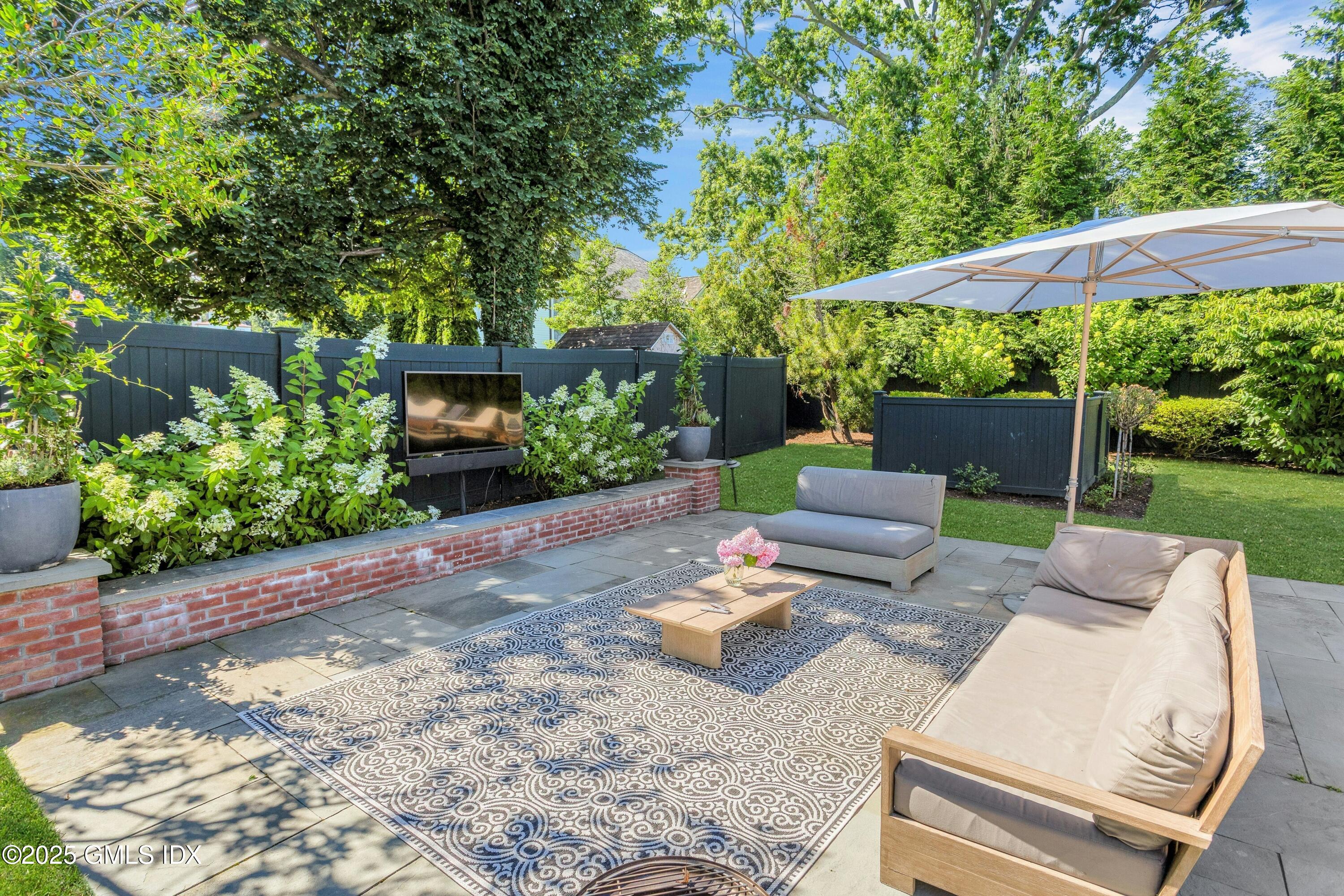 40 Willowmere Circle Riverside, CT 06878 - Photo 28 of 34 a view of backyard of house with seating space
