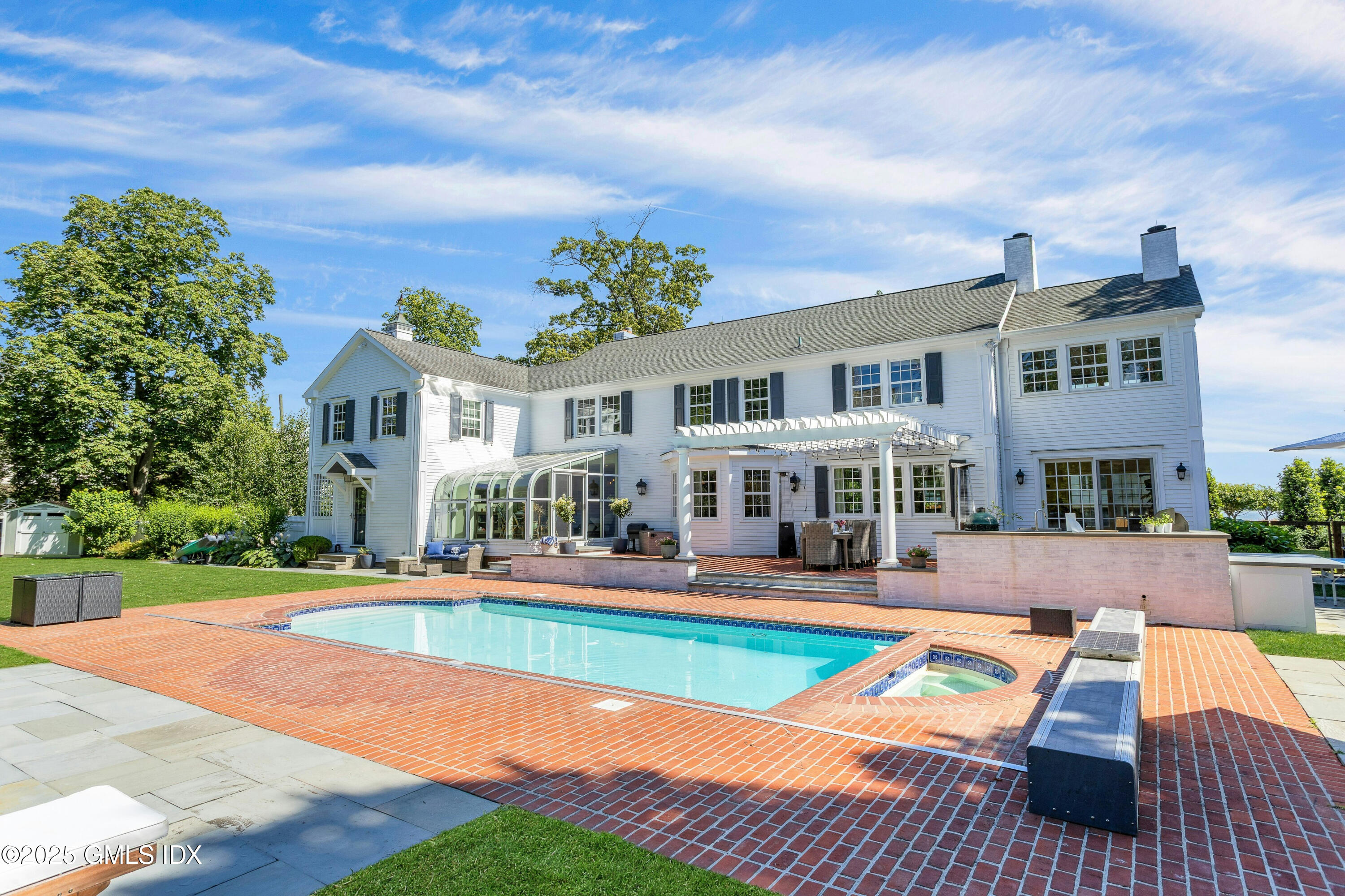 40 Willowmere Circle Riverside, CT 06878 - Photo 29 of 34 a view of a house with swimming pool and sitting area