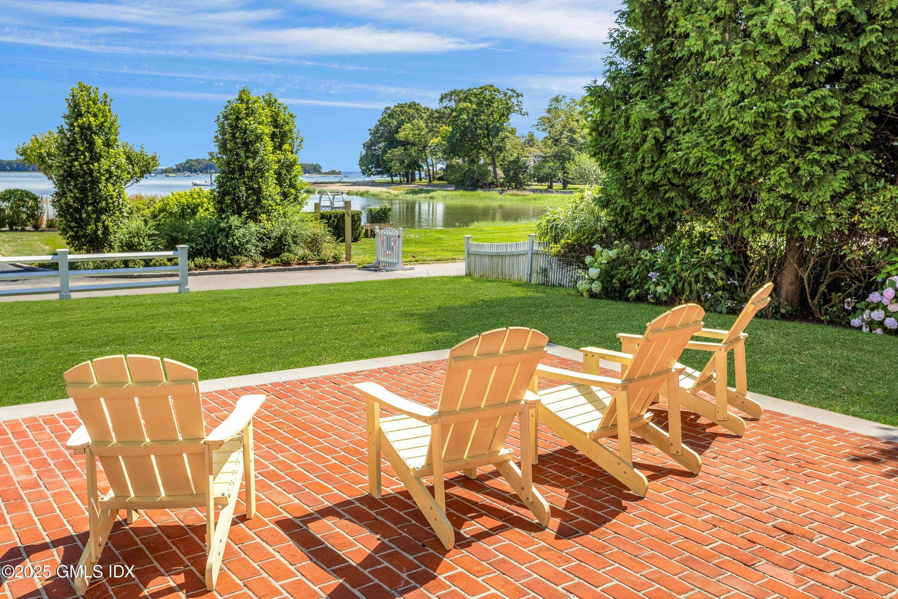 40 Willowmere Circle Riverside, CT 06878 - Photo 30 of 34 a view of a table and chairs in the garden