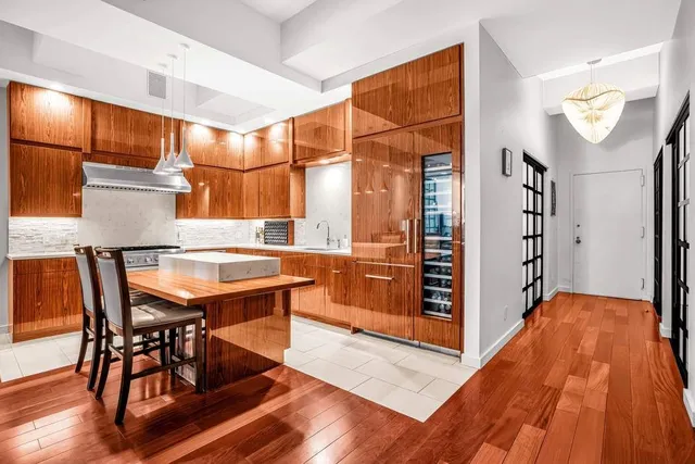 a kitchen with stainless steel appliances granite countertop a stove and a sink