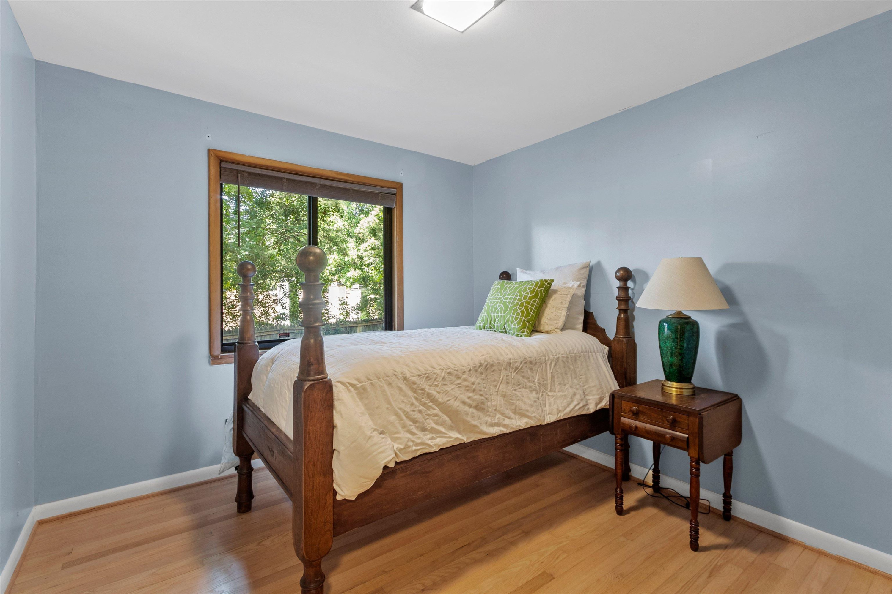 3207 Cyanne Circle Raleigh, NC 27606 - Photo 25 of 43 a bedroom with a bed table and window