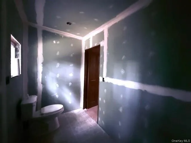 a view of a hallway with a room