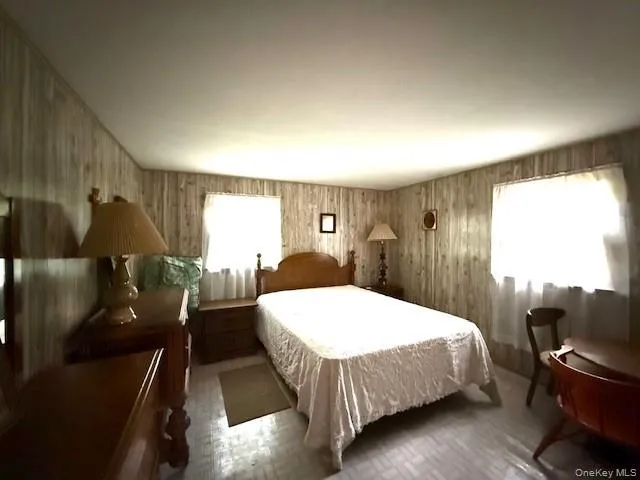 a bed room with a bed and furniture