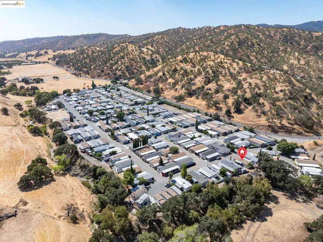 an aerial view of multiple house with a yard