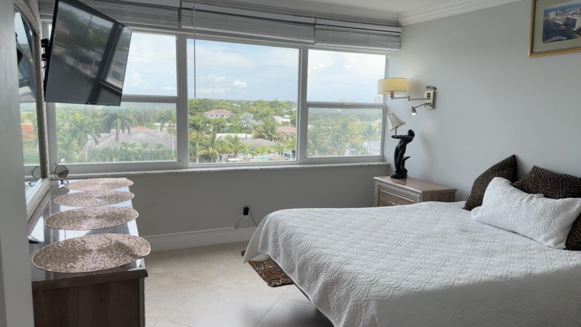 2611 North Riverside Drive, Unit 703 Pompano Beach, FL 33062 - Photo 75 of 81 a bedroom with a bed and a window