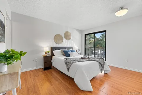 a bed room with a bed and a potted plant