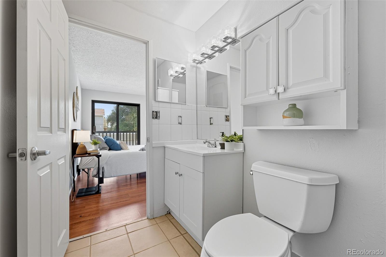 381 South Ames Street, Unit C204 Lakewood, CO 80226 - Photo 21 of 34 a bathroom with a sink a toilet and bathtub