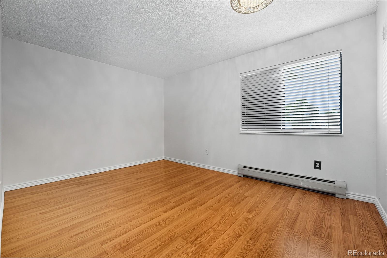 381 South Ames Street, Unit C204 Lakewood, CO 80226 - Photo 23 of 34 a view of a room with wooden floor and windows
