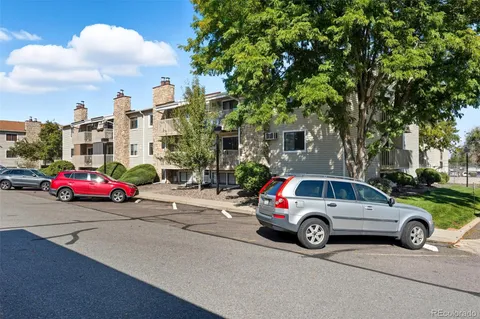 a view of cars parked in a parking lot