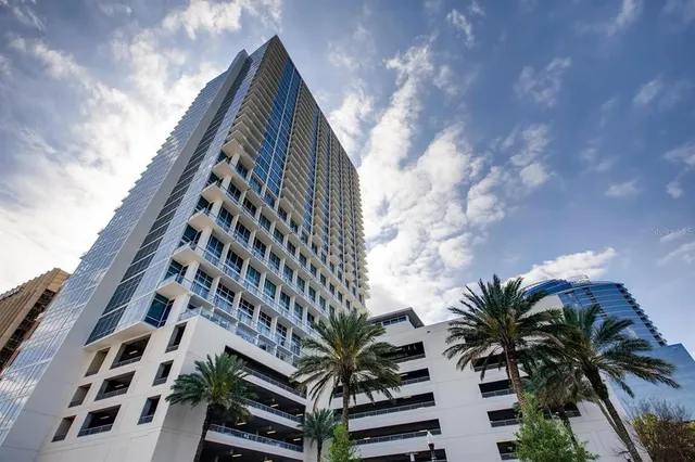 a balcony with table and chairs
