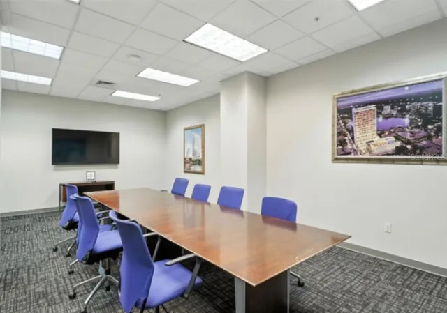 a view of swimming pool with outdoor seating and lake view