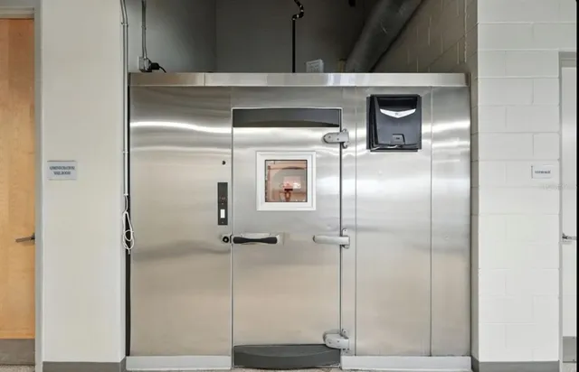 a view of a roof deck with table and chairs