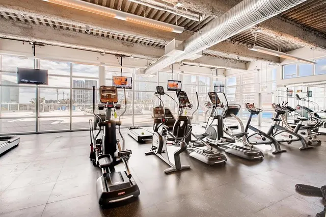 a view of room with cabinet and windows