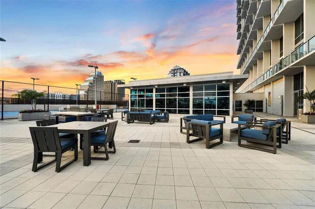 a view of a room with a ceiling fan and entryway