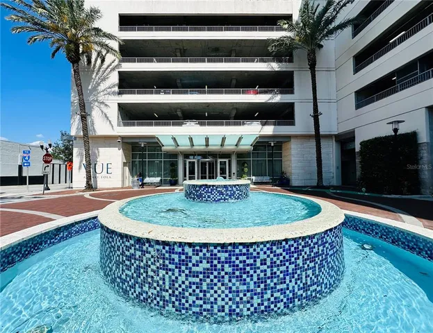 a view of a entryway with a flower pot on the side of a door