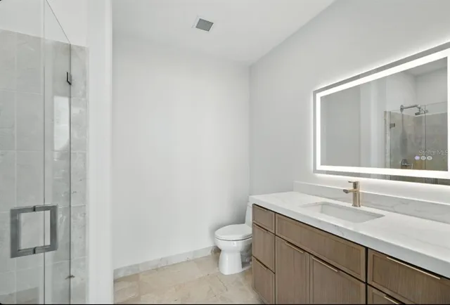 a bath tub sitting in a bathroom next to a sink