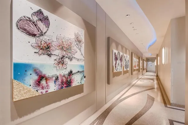 a view of a hallway with wooden shelves