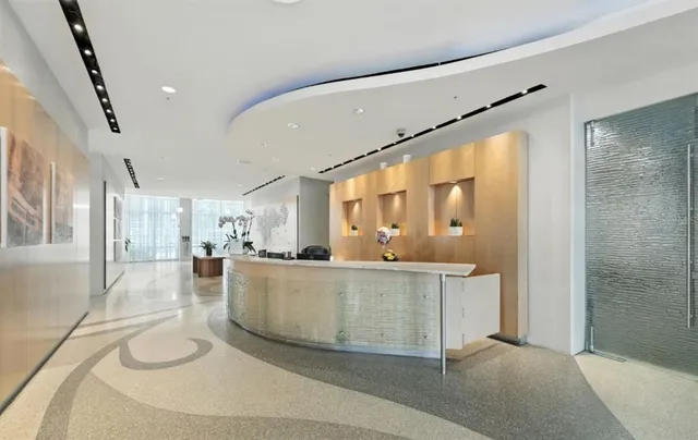 a bathroom with a shower and a glass door shower