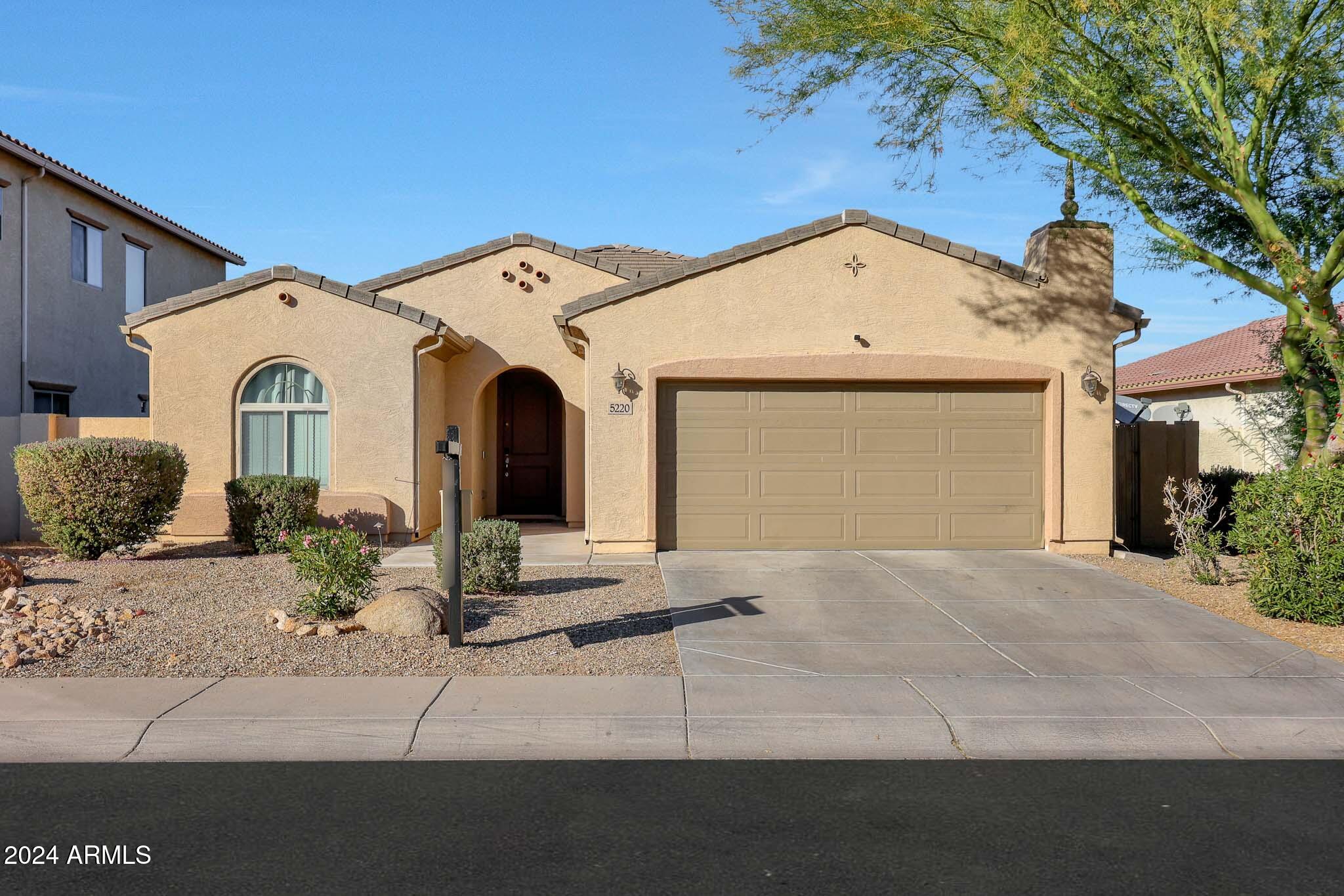 5220 West Beverly Road Laveen, AZ 85339 - Photo 1 of 49 a view of a white house with a outdoor space