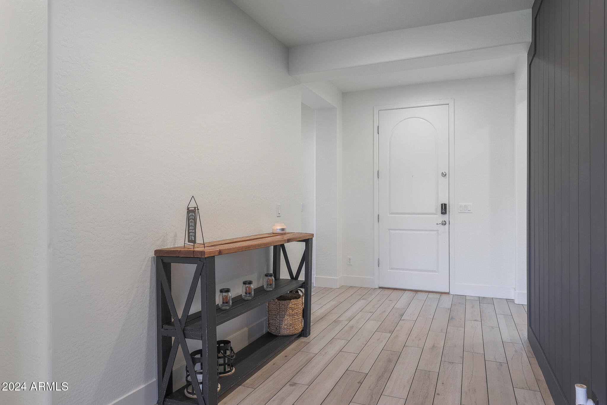5220 West Beverly Road Laveen, AZ 85339 - Photo 14 of 49 a view of a bedroom with furniture and wooden floor