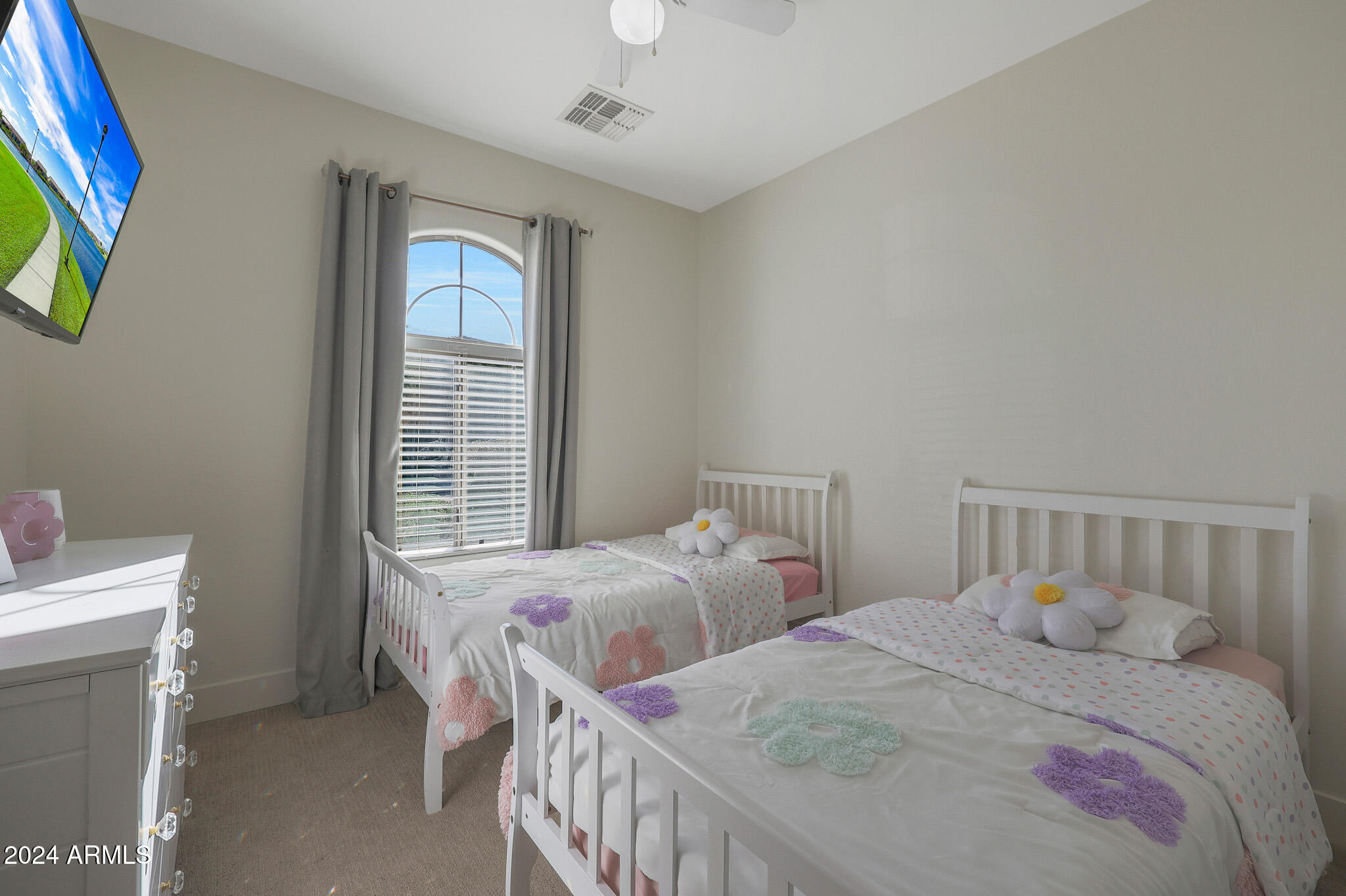 5220 West Beverly Road Laveen, AZ 85339 - Photo 23 of 49 a bedroom with two beds and a window