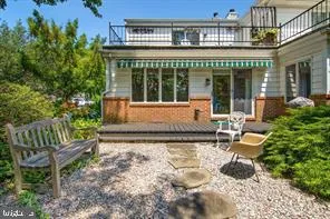 a house view with a sitting space and garden space