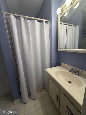 a bathroom with a sink and mirror