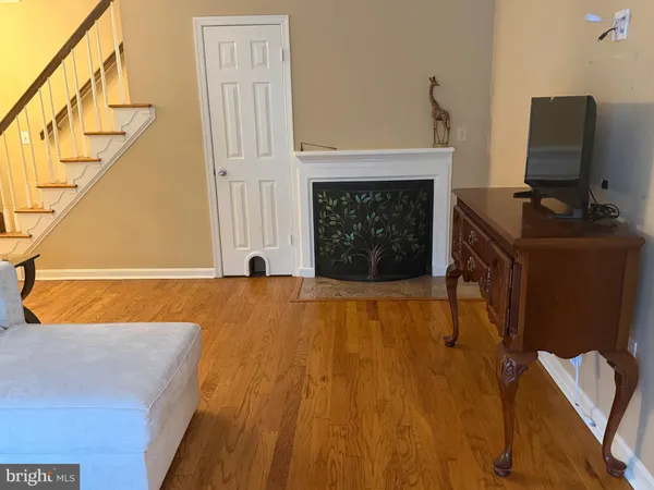 a bedroom with a bed and a fireplace