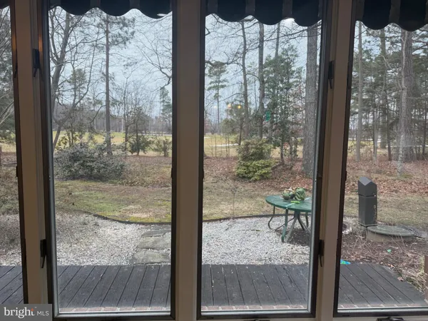a view of a glass door and porch