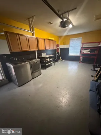 a storage room with wooden floor and windows