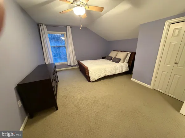 a bed room with a bed and a couch