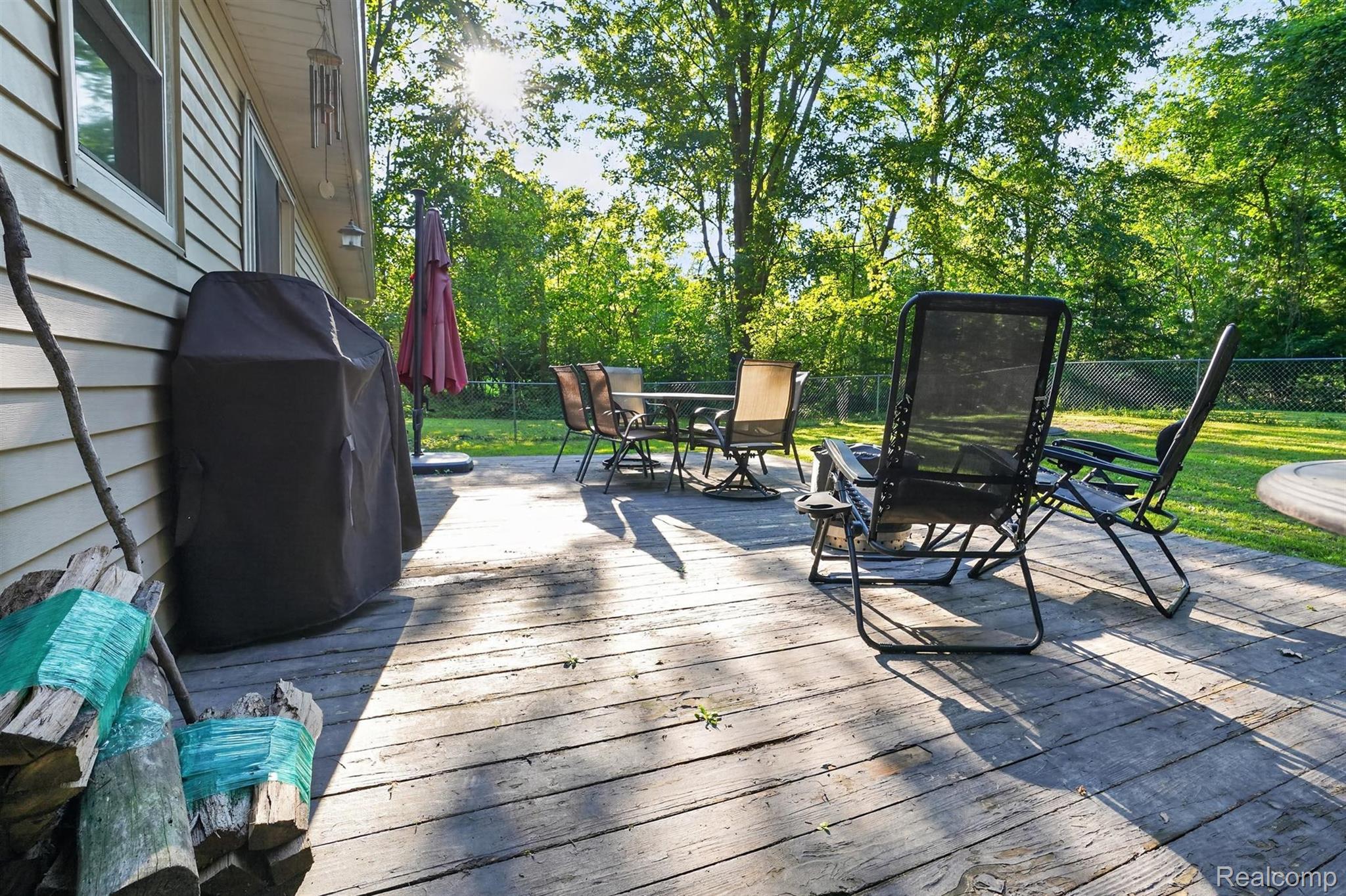 8696 West Sargent Road Fowlerville, MI 48836 - Photo 28 of 36 Spacious outdoor deck featuring natural wood planks