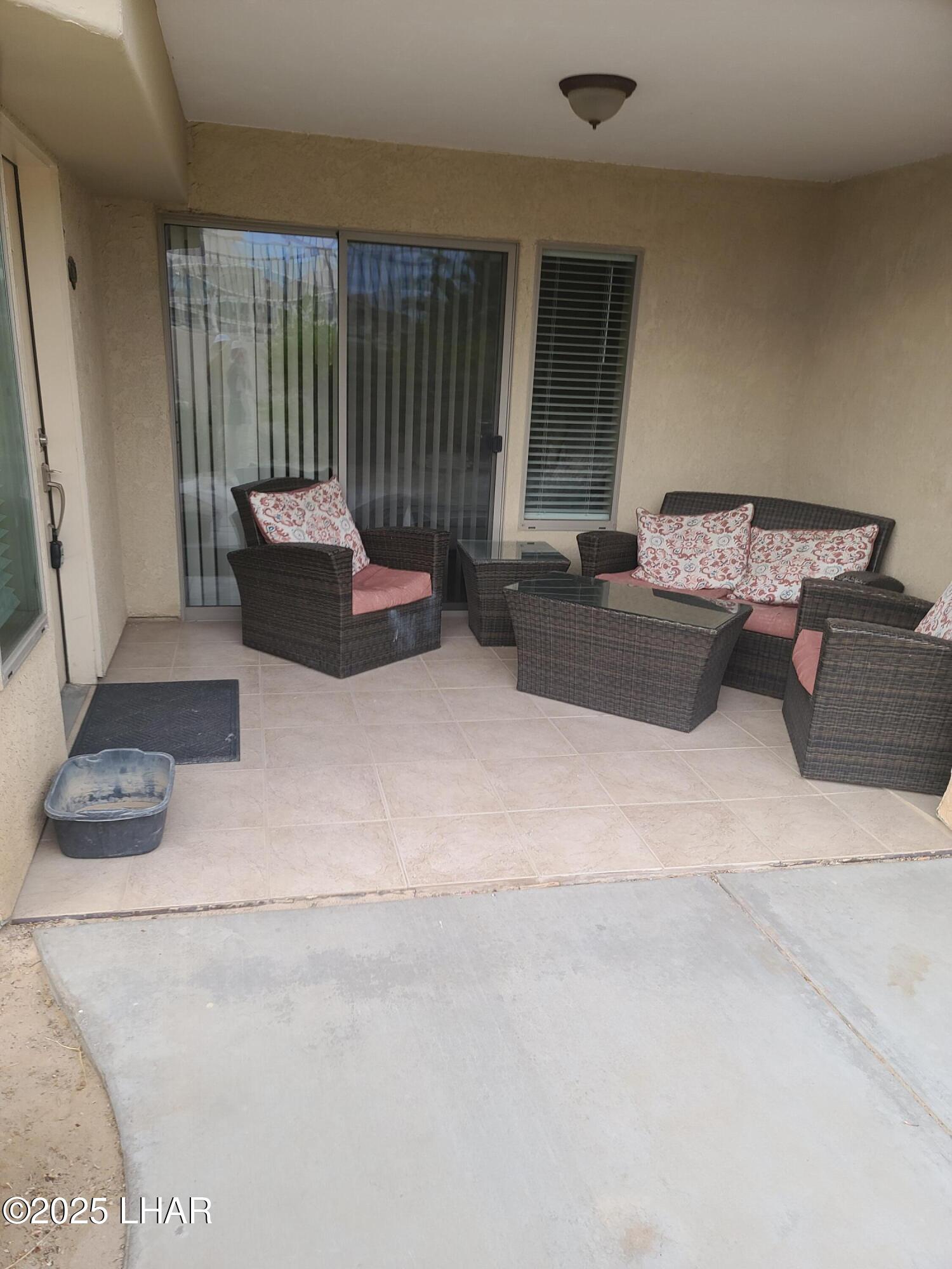 94 London Bridge Road, Unit 108 Lake Havasu City, AZ 86403 - Photo 10 of 38 a living room with furniture and a window