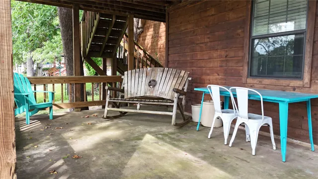 a view of front door with outdoor seating