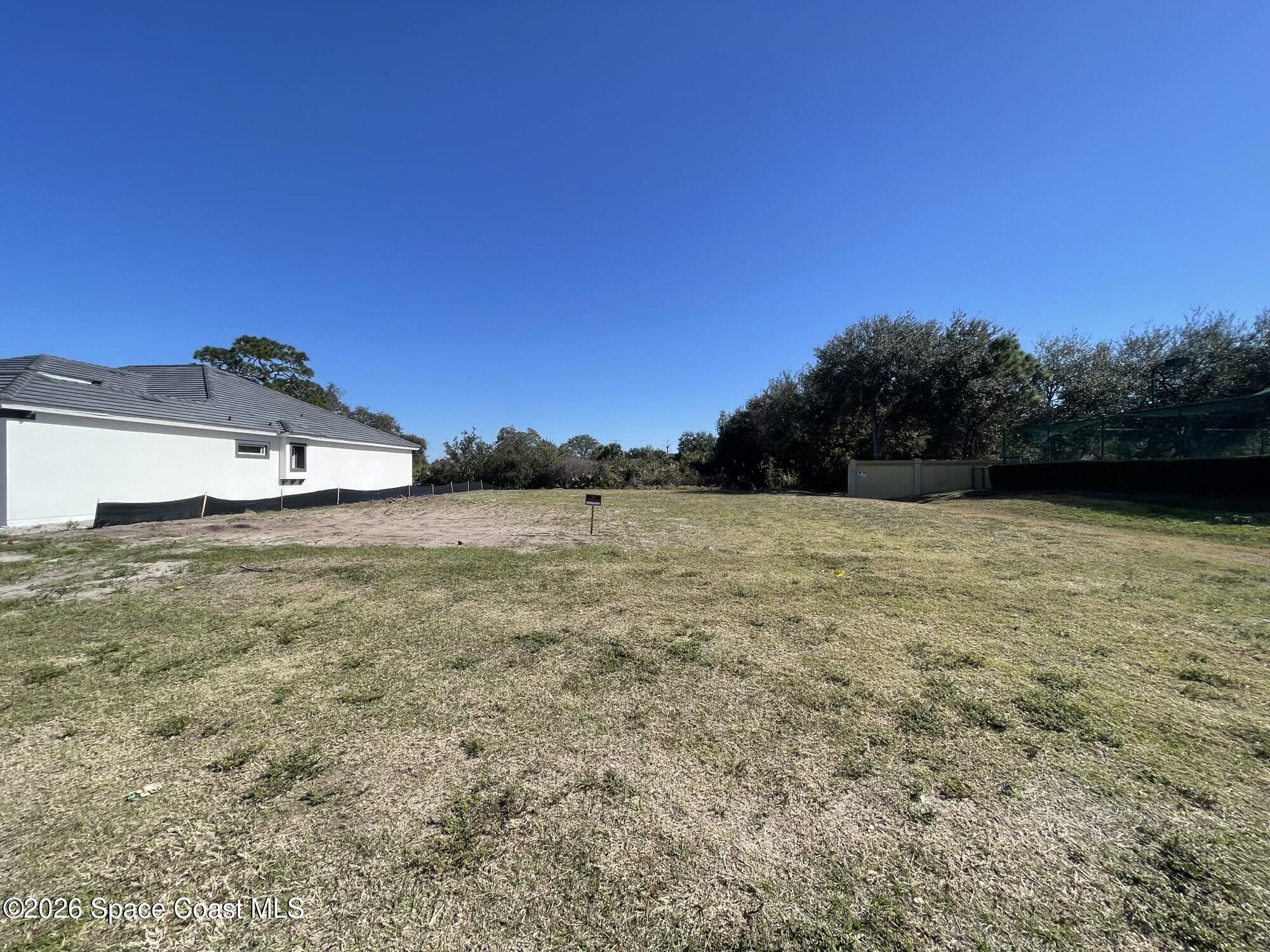 3220 Cappannelle Drive Melbourne, FL 32940 - Photo 2 of 6 a view of a lake with a yard